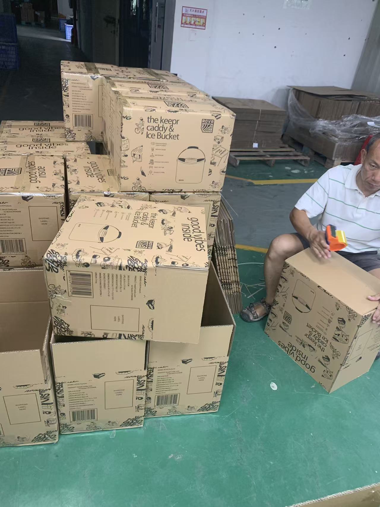 Final industrial packaging area at Sealock factory with custom form factor shipping cartons prepared for global logistics